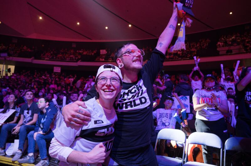San Francisco Shock fans Chloe Barrocas and Anthony Hanly celebrate as the Shock overwhelmed the Houston Outlaws in the finals of the losers’ bracket 3-0. No. 2 seed Shock avenged their early upset by the no. 6 seed Outlaws after a hard-fought lower bracket run, besting five teams in order to reach the grand finals. (Photo by Michael Chow)