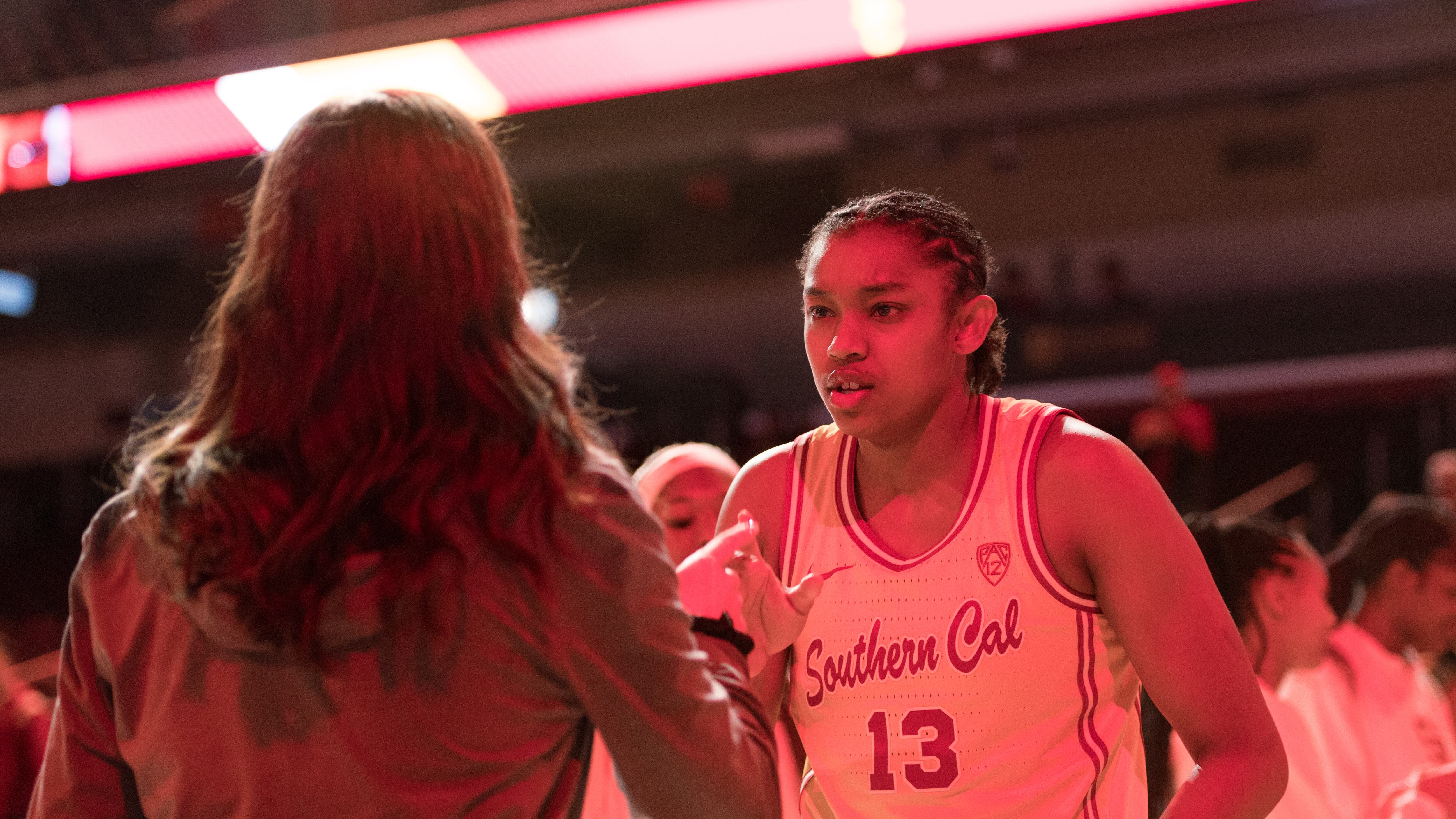 Marshall does a handshake with a teammate during starting lineup intros.