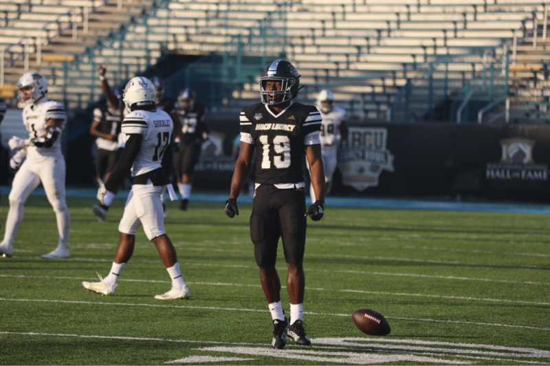 Team Robinson wide receiver Xavier Smith smiles and flexes after making the catch of the game.